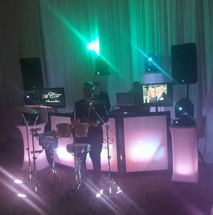 Live percussionist performing alongside DJ Louie G